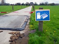 Herstel schade grasveld Malieveld in Den Haag